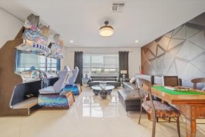 a living room with a couch and a table at The Bling Estate in Kissimmee
