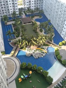 an aerial view of a pool at a resort at Shore residences tower D in Manila