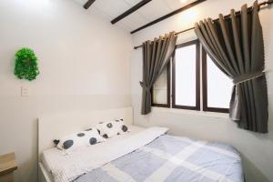 Postel nebo postele na pokoji v ubytování BKV Homestay