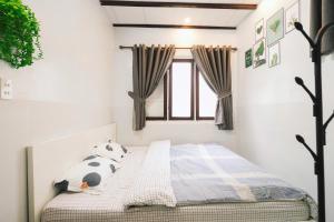 Postel nebo postele na pokoji v ubytování BKV Homestay