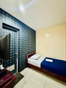 TV a/nebo společenská místnost v ubytování CDO Hotel Xentro