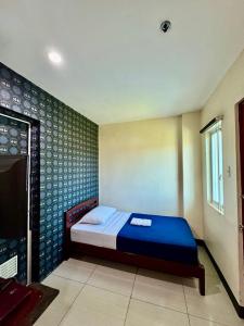 Postel nebo postele na pokoji v ubytování CDO Hotel Xentro