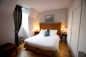 Ένα ή περισσότερα κρεβάτια σε δωμάτιο στο Le Moulin De Connelles