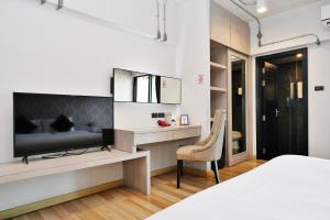 Postel nebo postele na pokoji v ubytování Diary Suite