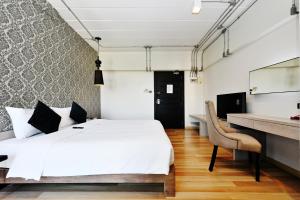 Postel nebo postele na pokoji v ubytování Diary Suite