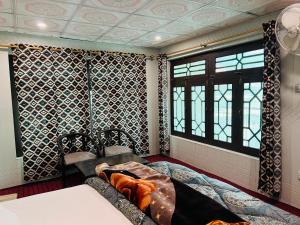 Postel nebo postele na pokoji v ubytování Skardu Lodge