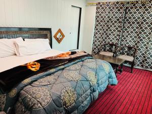 Postel nebo postele na pokoji v ubytování Skardu Lodge