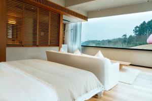 Voodi või voodid majutusasutuse Adamu Nature Resort toas