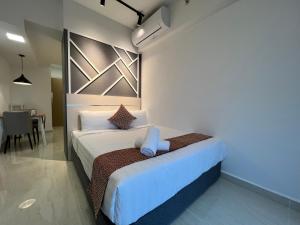 Ein Bett oder Betten in einem Zimmer der Unterkunft The Colony By Infinitum Flixses
