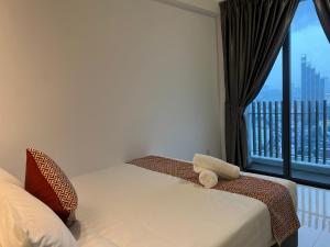 Ein Bett oder Betten in einem Zimmer der Unterkunft The Colony By Infinitum Flixses