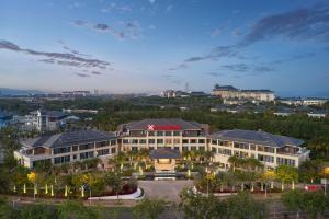 an aerial view of a large building with a courtyard at Hilton Garden Inn Sanya Haitang Bay in Sanya