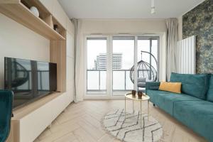 Un lugar para sentarse en Old Town River Suite with Balcony & Parking Wrocław by Noclegi Renters