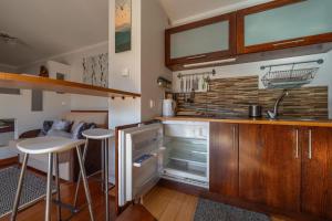 Kuchyň nebo kuchyňský kout v ubytování WHY NOT Apartamenty widokowe PANORAMA + 8 fotografií