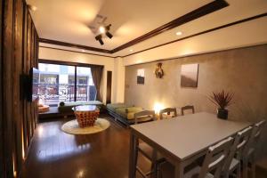 a living room with a table and a couch at サンモールクレスト403 in Tokyo +53 photos