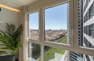 Pemandangan umum bagi Málaga atau pemandangan bandar yang diambil dari apartmen