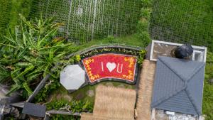 Giardino di The Macaw Ubud Green Uma Villa