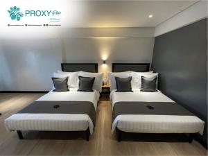 Letto o letti in una camera di PROXY Plus Pangasinan