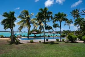 a view of the pool at the resort at 4- Bedroom Beachfront Villa in Grand Baie