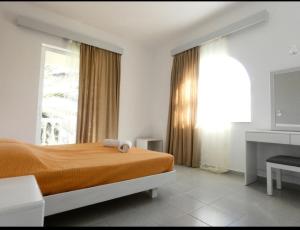 Ένα ή περισσότερα κρεβάτια σε δωμάτιο στο Paras Beach Apartments +4 φωτογραφίες