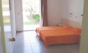 Ένα ή περισσότερα κρεβάτια σε δωμάτιο στο Paras Beach Apartments
