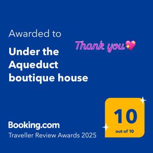 a yellow box with the words awarded to under the house at Under the Aqueduct boutique house in Kavála