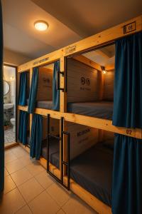 a couple of bunk beds in a room at Mao's Party Experiment in Bogotá +13 photos