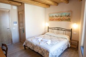 Postel nebo postele na pokoji v ubytování Scorci Di Mare