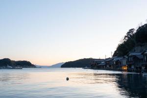 a person swimming in a body of water at 青海波 in Ine