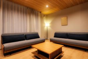 Χώρος καθιστικού στο Ginkgo House ギンコハウス