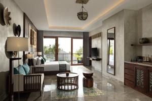 a bedroom with a bed and a living room at Inara Alas Harum in Ubud +75 photos