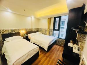 Postel nebo postele na pokoji v ubytování Hou Kong Boutique Hostel