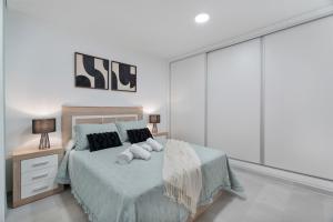 Katil atau katil-katil dalam bilik di Apartamento Iris Tropical