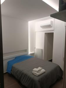 Postel nebo postele na pokoji v ubytování CIVICO 14 Holiday Rooms