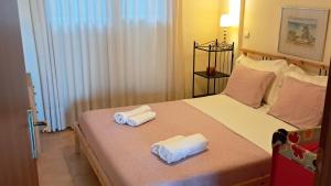 Giường trong phòng chung tại Kassandra Cozy Bungalow