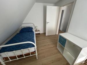 Ένα ή περισσότερα κρεβάτια σε δωμάτιο στο Gemütliche Ferienwohnung Adelby