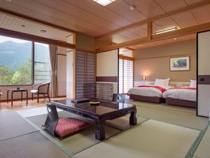 Postel nebo postele na pokoji v ubytování Matsusaka Doggie Paradise Hotel Smeall
