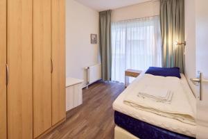 Postel nebo postele na pokoji v ubytování De Pelikaan Texel Appartementen