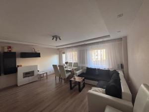 a living room with a couch and a table at Wake Park Apartartament in Głowno