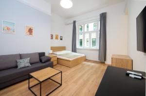 a living room with a couch and a table at Pillow Heaven King BB in Budapest