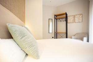 Posteľ alebo postele v izbe v ubytovaní Chinitas Urban Rooms