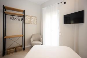 Posteľ alebo postele v izbe v ubytovaní Chinitas Urban Rooms