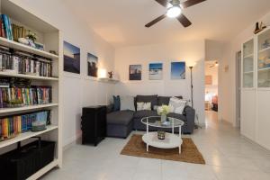 a living room with a couch and a table at Clarona in Cala en Blanes