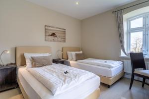 Postel nebo postele na pokoji v ubytování Lille Hus 2 + 25 fotografií