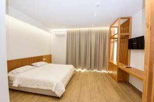 Postel nebo postele na pokoji v ubytování Hotel Nimfa