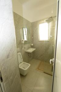 Koupelna v ubytování Hotel Nimfa