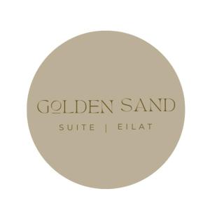 Un cercle blanc avec les mots de sable doré dans l'établissement GOLDEN SAND Suite, à Eilat