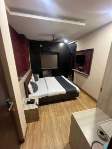 Postel nebo postele na pokoji v ubytování Prashant Hotel