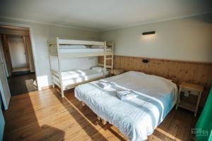 a bedroom with a bed and bunk beds in it at Le Noir Flohay 30 pers - Malmedy, vue, wellness in Malmedy