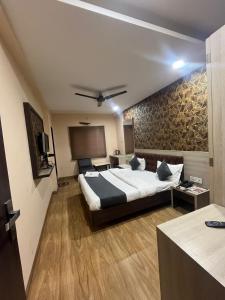 Postel nebo postele na pokoji v ubytování Prashant Hotel
