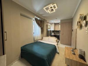 a bedroom with a large bed in a room at Bloom Garden 1 in Mytilene